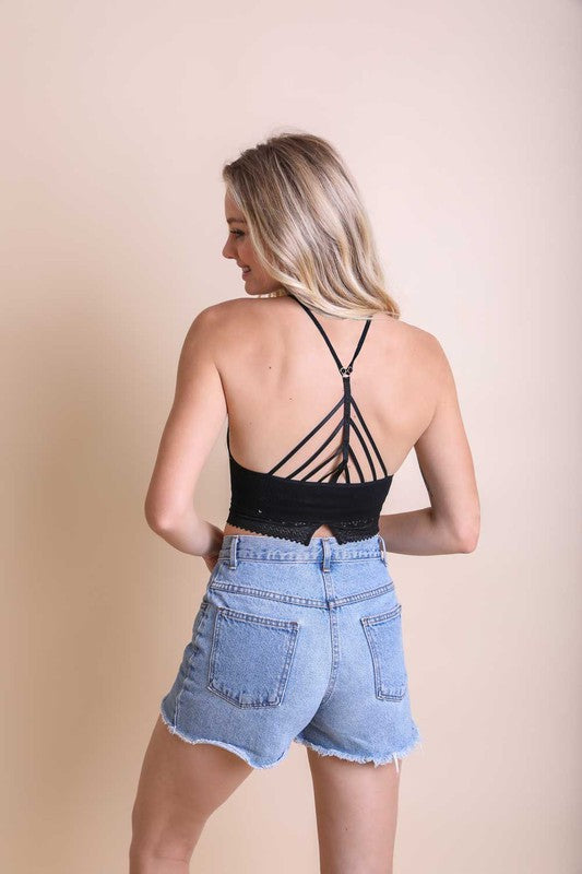 Black high-neck bralette with open back crisscross straps and lace hem