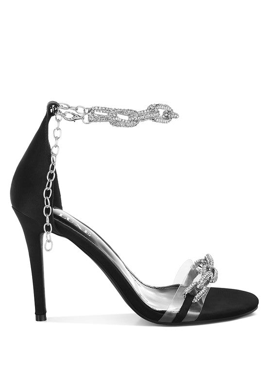 Black stiletto sandal with rhinestone ankle chain and clear strap, side view