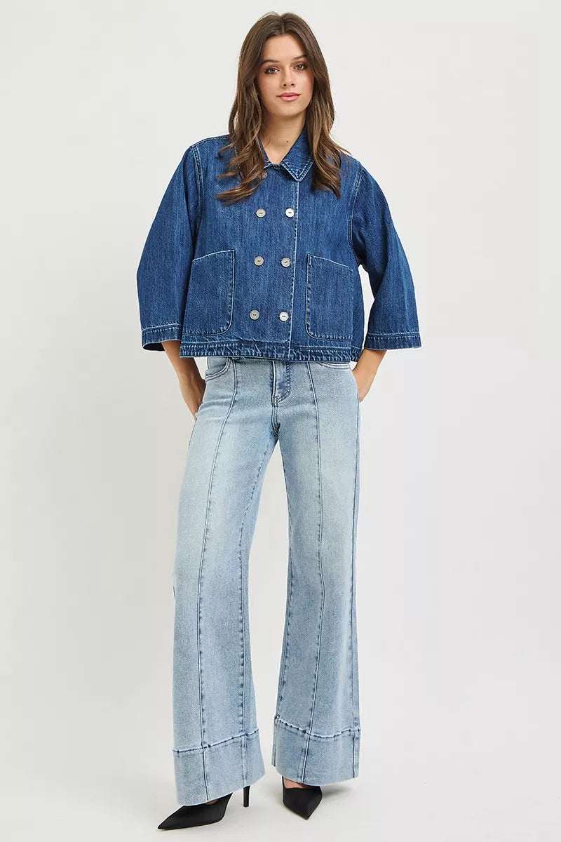Dark blue cropped denim jacket with double-breasted buttons and chest flap pockets