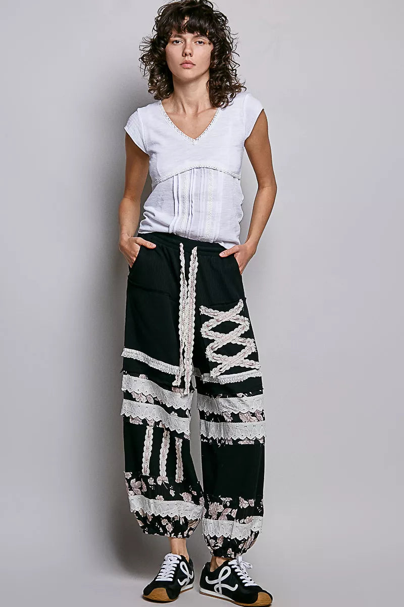 Off-white short-sleeve textured knit top with lace V-neck trim
