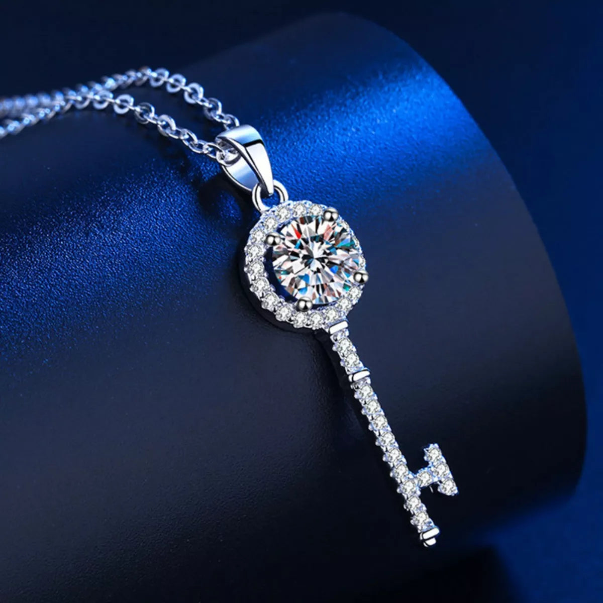 Sterling silver key pendant necklace with round moissanite center and pavé key drop
