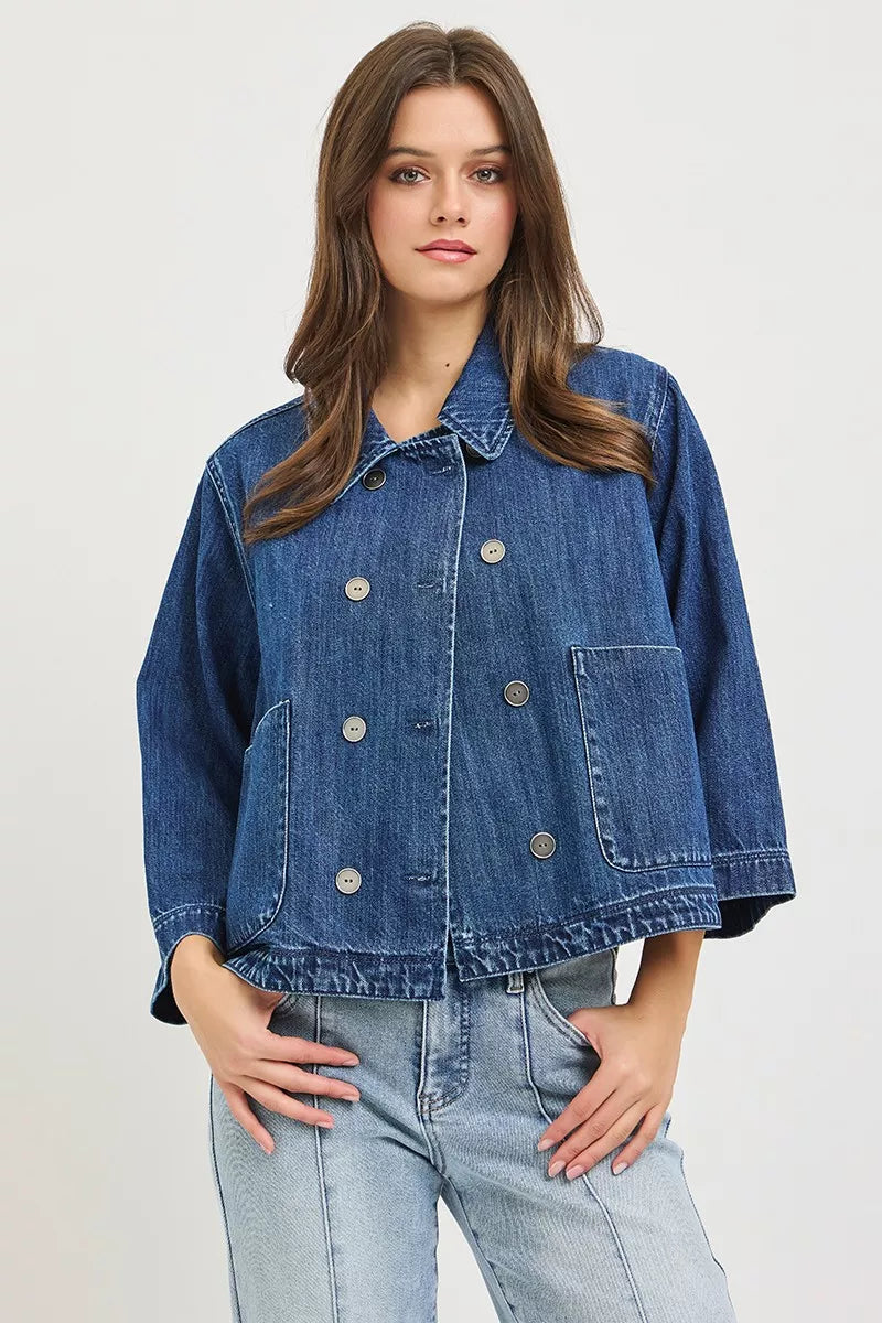 Dark blue cropped double-breasted denim jacket with flap pockets and buttoned front placket