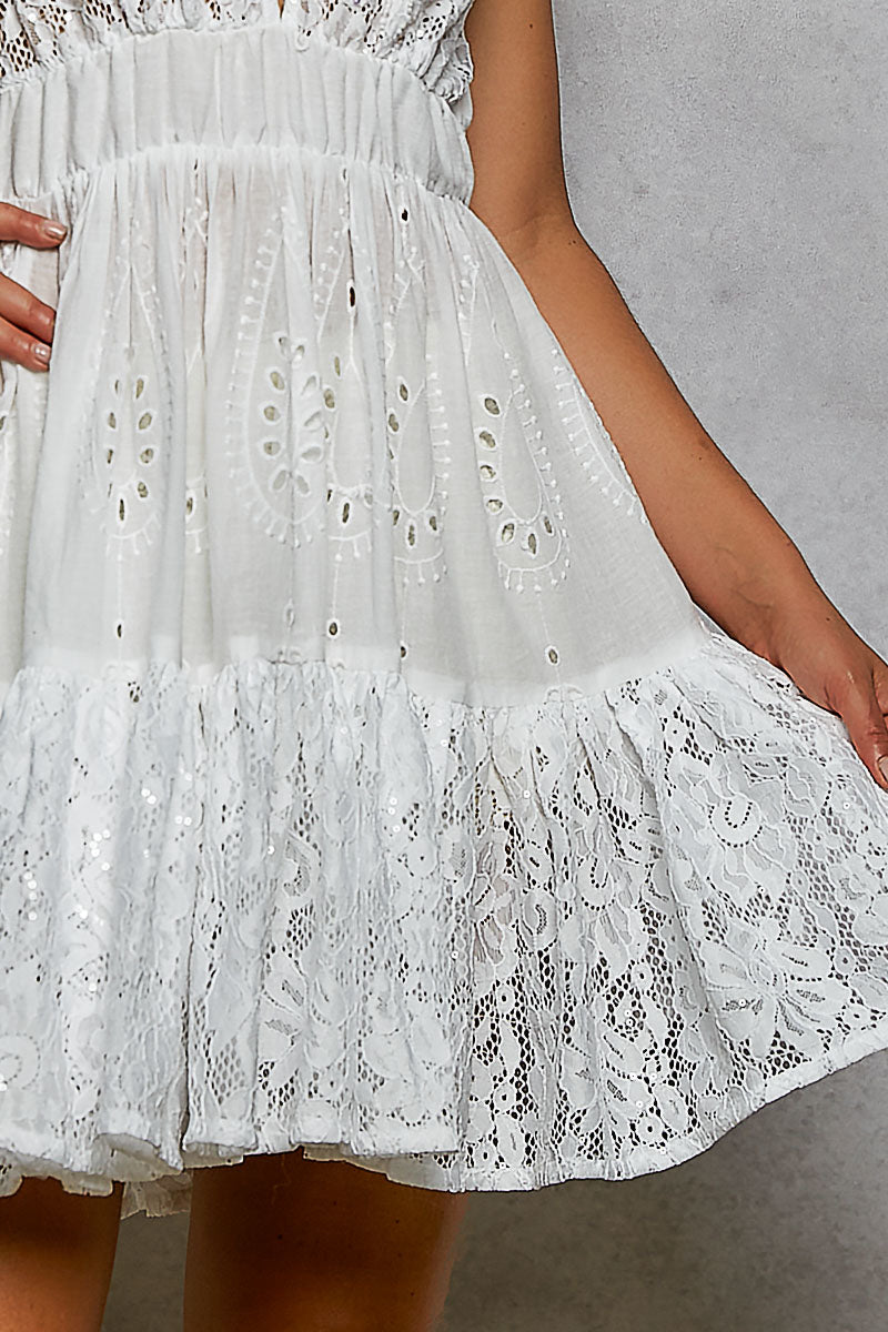 Ivory tiered ruffle mini skirt with eyelet lace panels and gathered seam