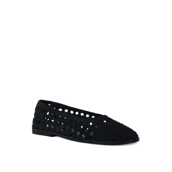 Black suede ballet flats with perforated cutout dots and low sole