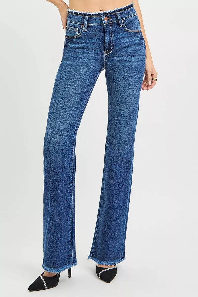 Dark blue bootcut jeans with frayed hem at the cuffs and front seam
