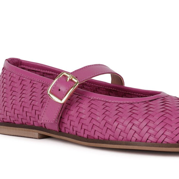 Fuchsia woven leather ballerina close-up with gold-tone buckle and ankle strap
