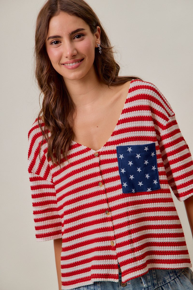Red-and-ivory striped cardigan with V-neck, front buttons, and blue star pocket panel