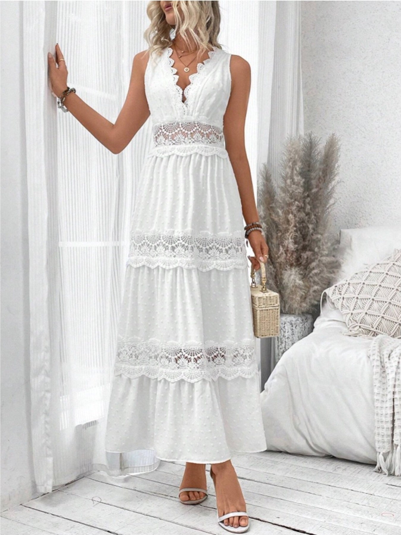 White sleeveless maxi dress with lace V neckline and tiered ruffles