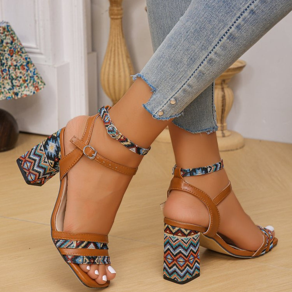 Light brown open-toe block heels with fabric patterned straps and ankle-strap buckle