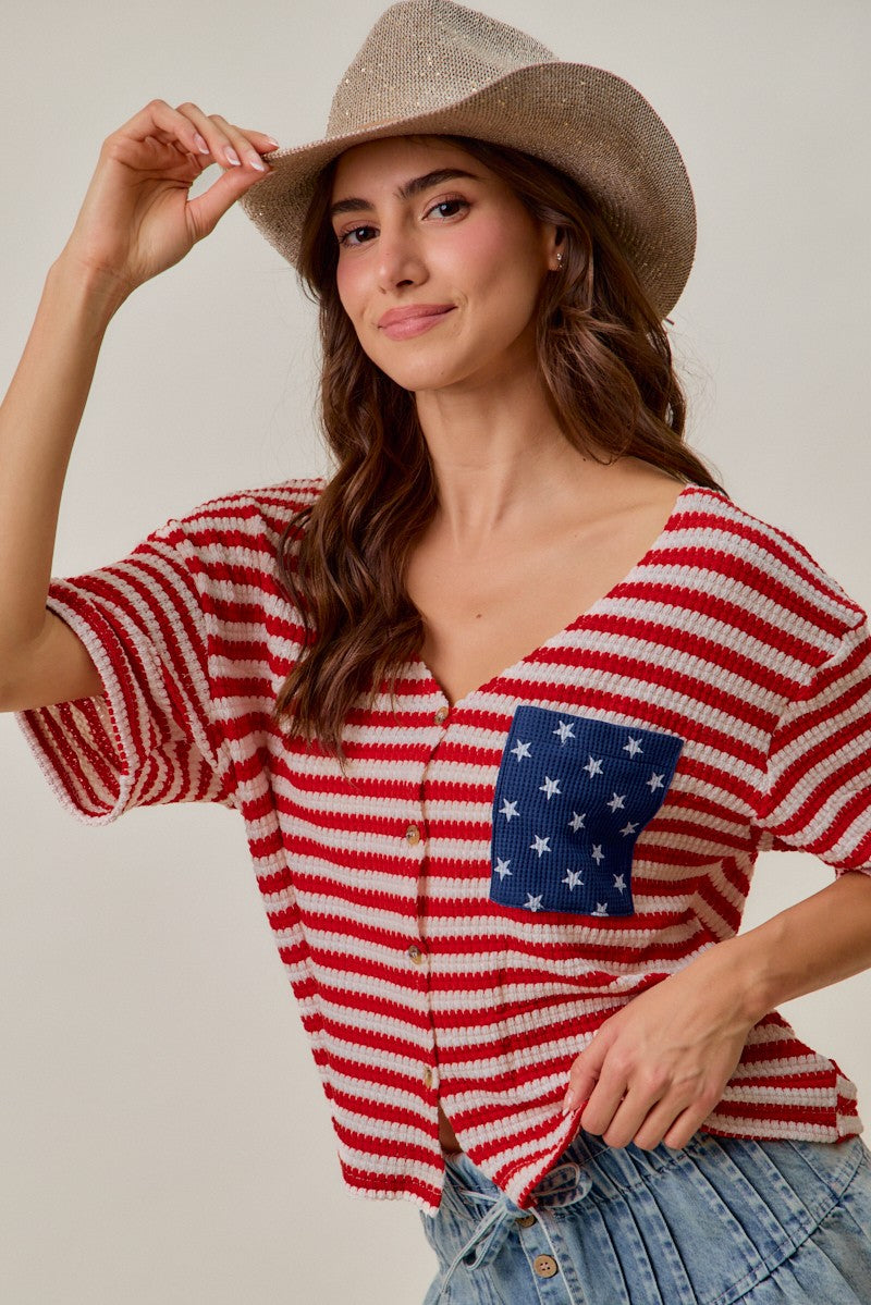 Red-and-ivory striped knit cardigan with blue star patch pocket and short sleeves