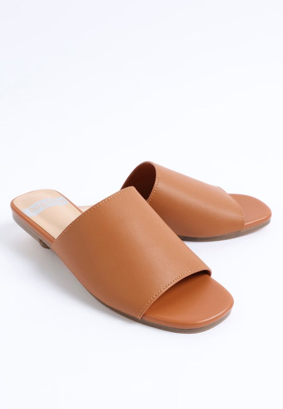 Tan slide flats with open square toe and stitched front strap