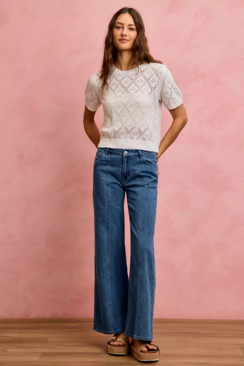 Mid-rise stretch denim jeans in light blue, seam detailing and wide bootcut legs
