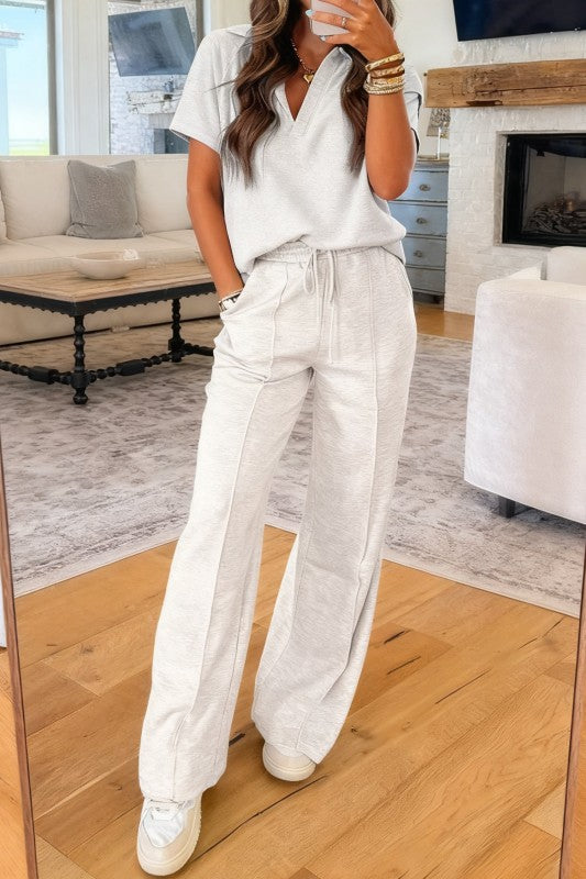 Light grey polo tee with drawstring waist jogger pants