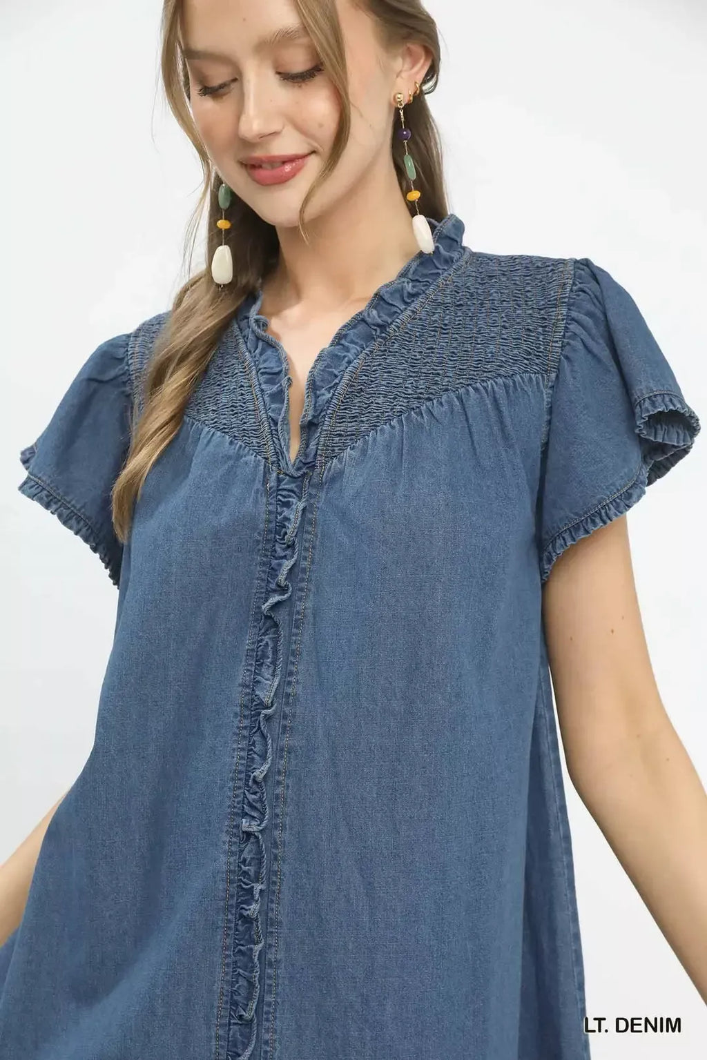 LT denim ruffle dress close-up: button placket and smocked neckline, flutter sleeves