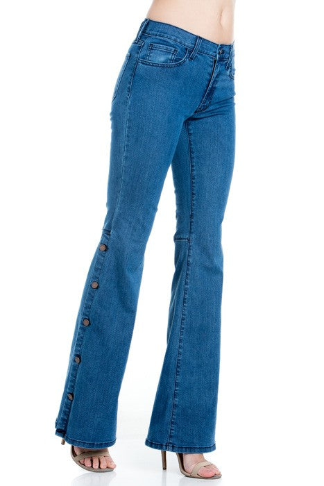 Medium wash flare denim jeans front pockets and stacked button trim, gold stitching