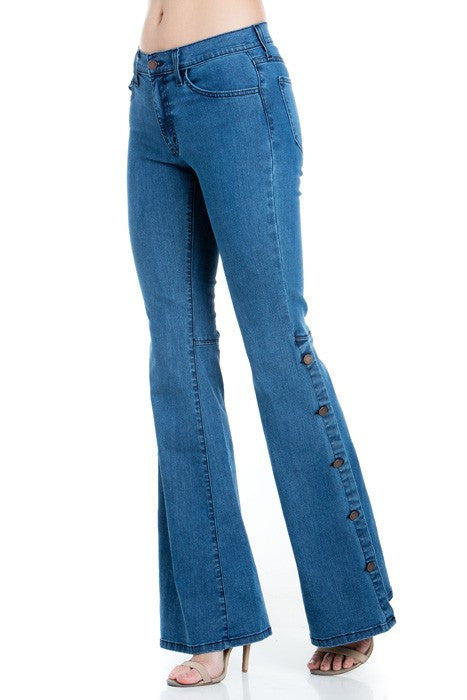 Medium wash denim flare jeans with front button placket and gold topstitch detail