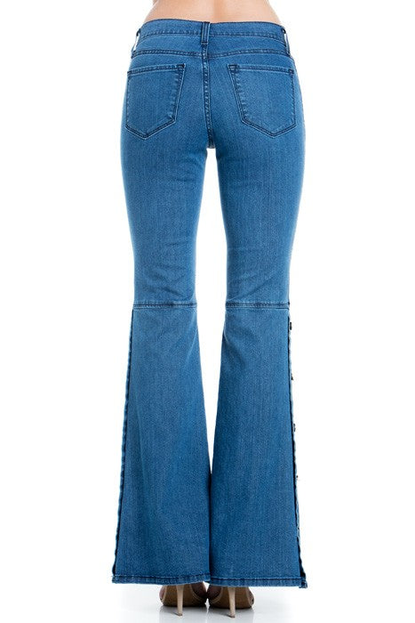Back view medium wash denim wide-leg jeans with back pockets and gold topstitch