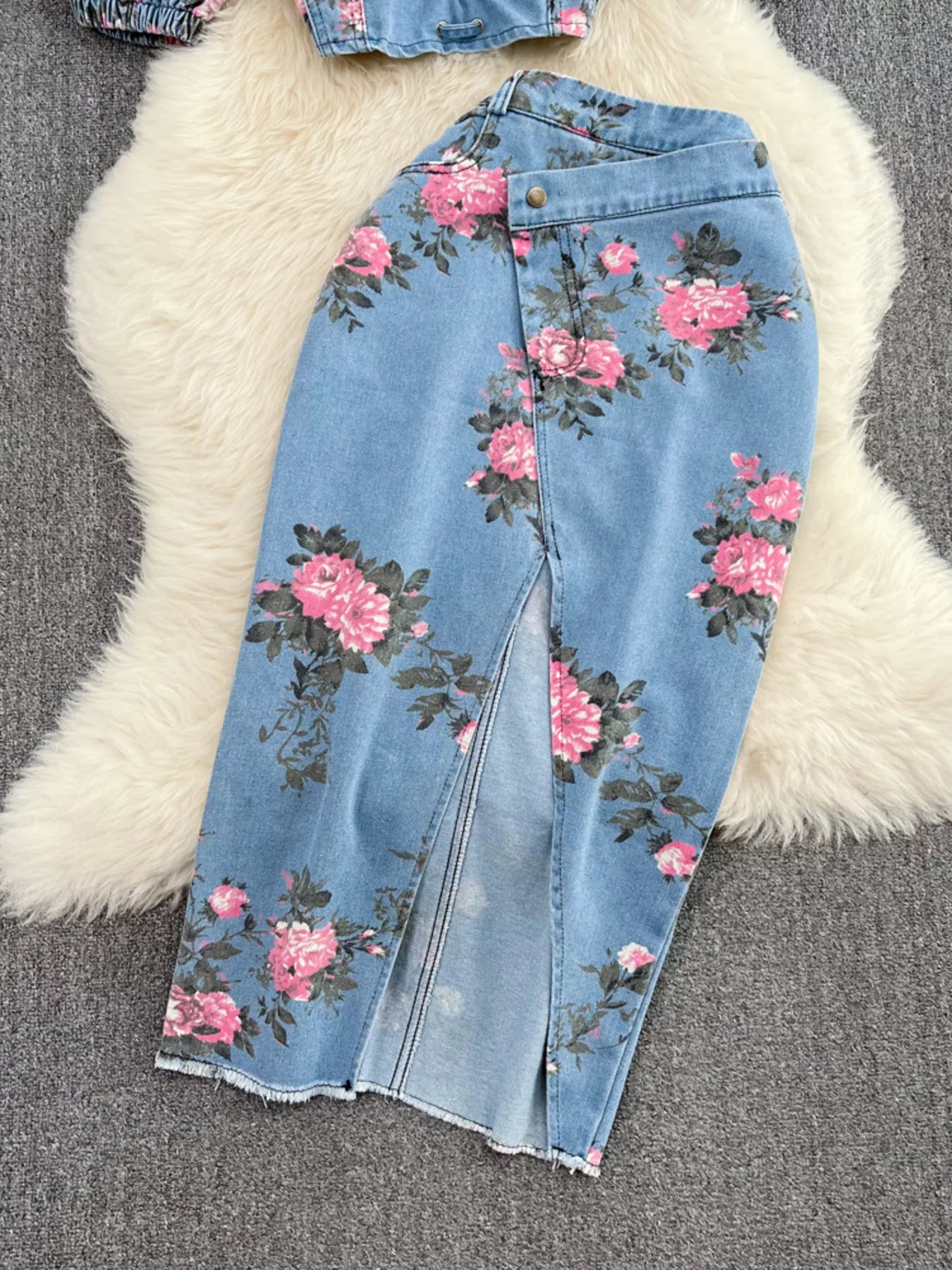 Blue denim skirt with pink floral print, front slit detail and button waistband