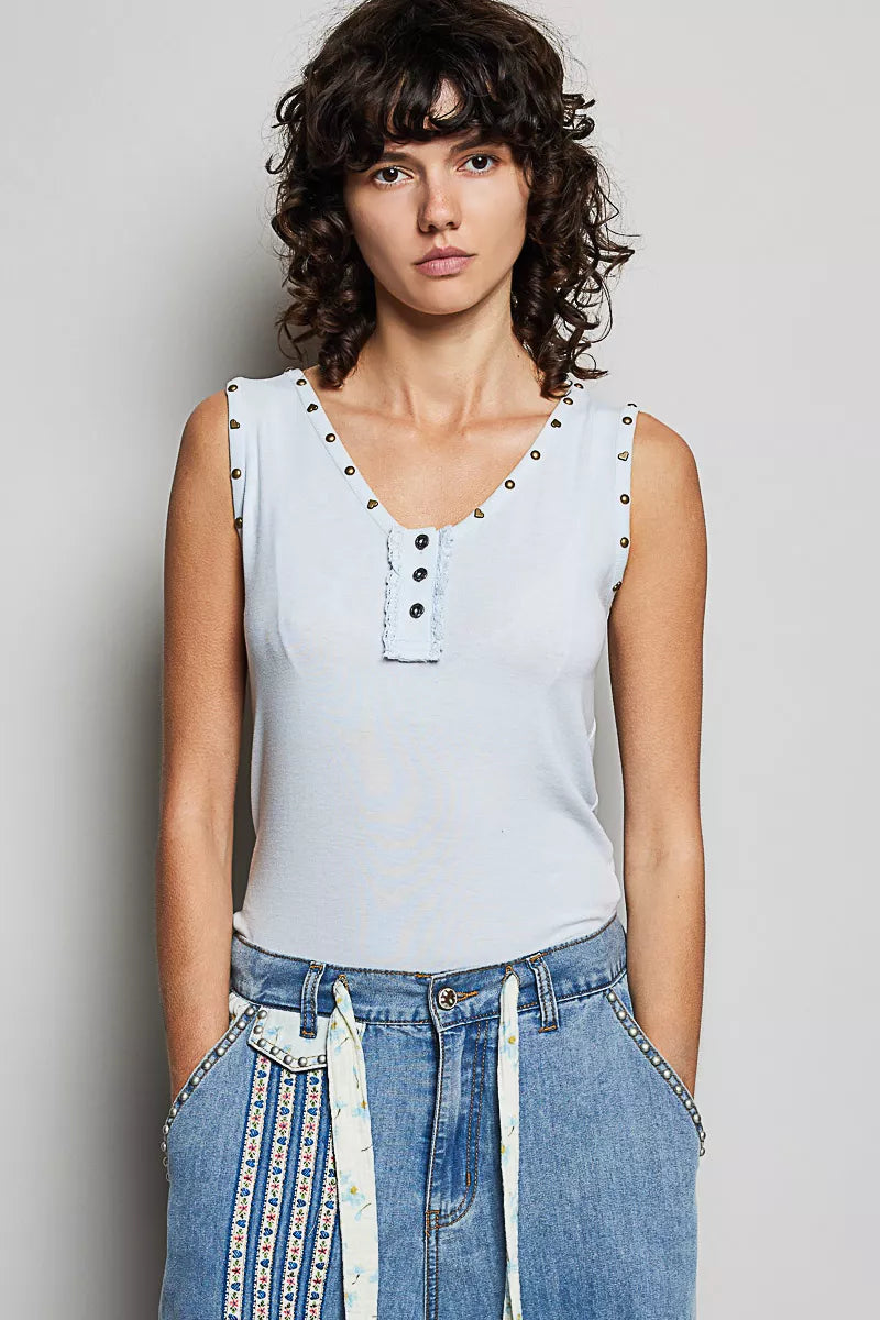 Baby blue sleeveless tank with button-front placket, studded trim, ruffle neckline