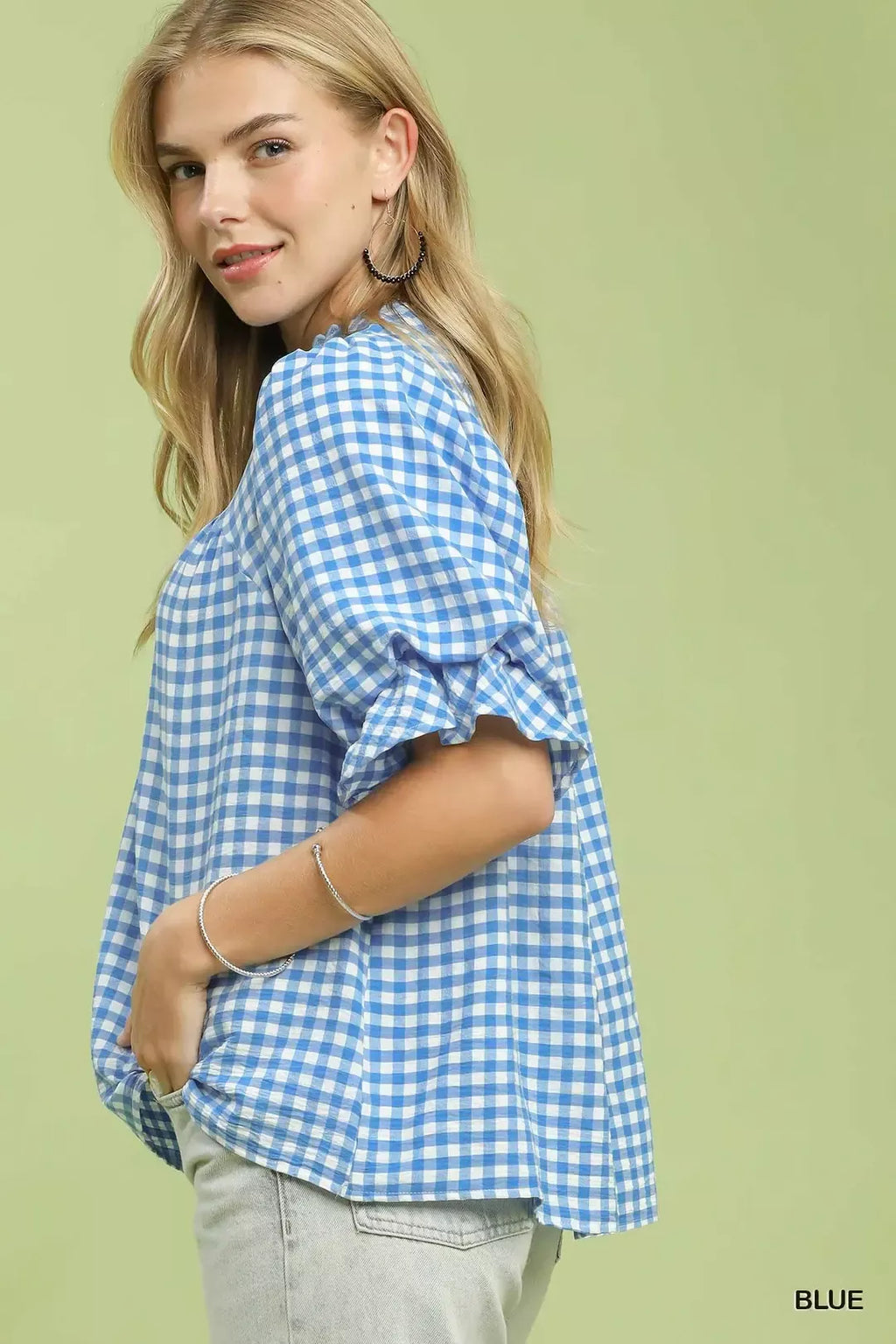 Blue gingham blouse, side view with gathered puff ruffle sleeves and loose fit