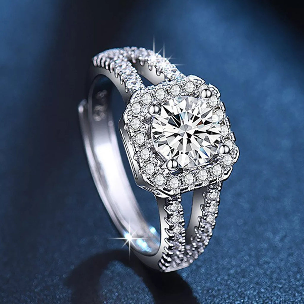 Sterling silver moissanite ring with large round center stone, halo pavé band