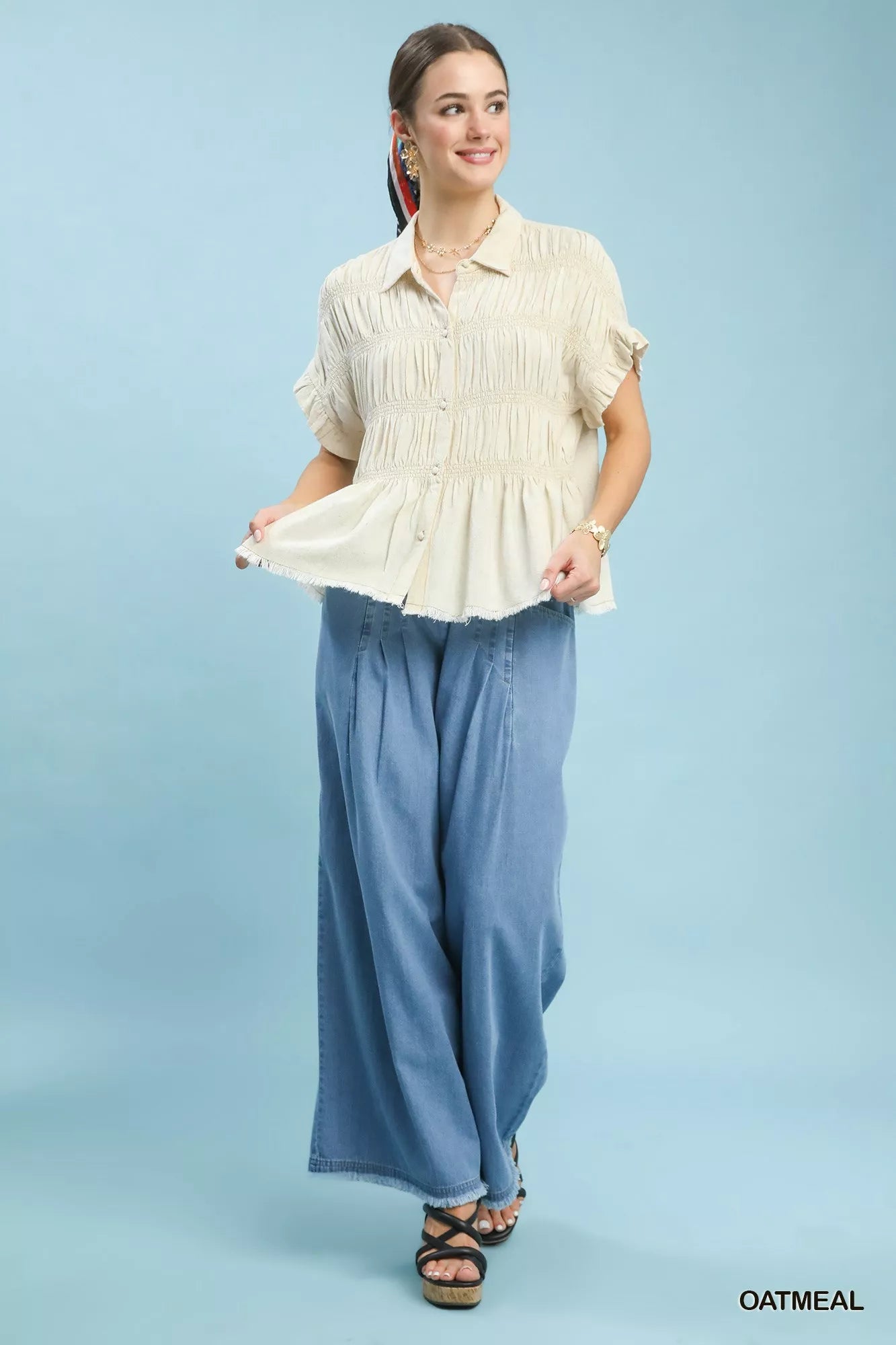 Oatmeal washed linen-blend smocked shirt with collared buttons and flutter peplum hem