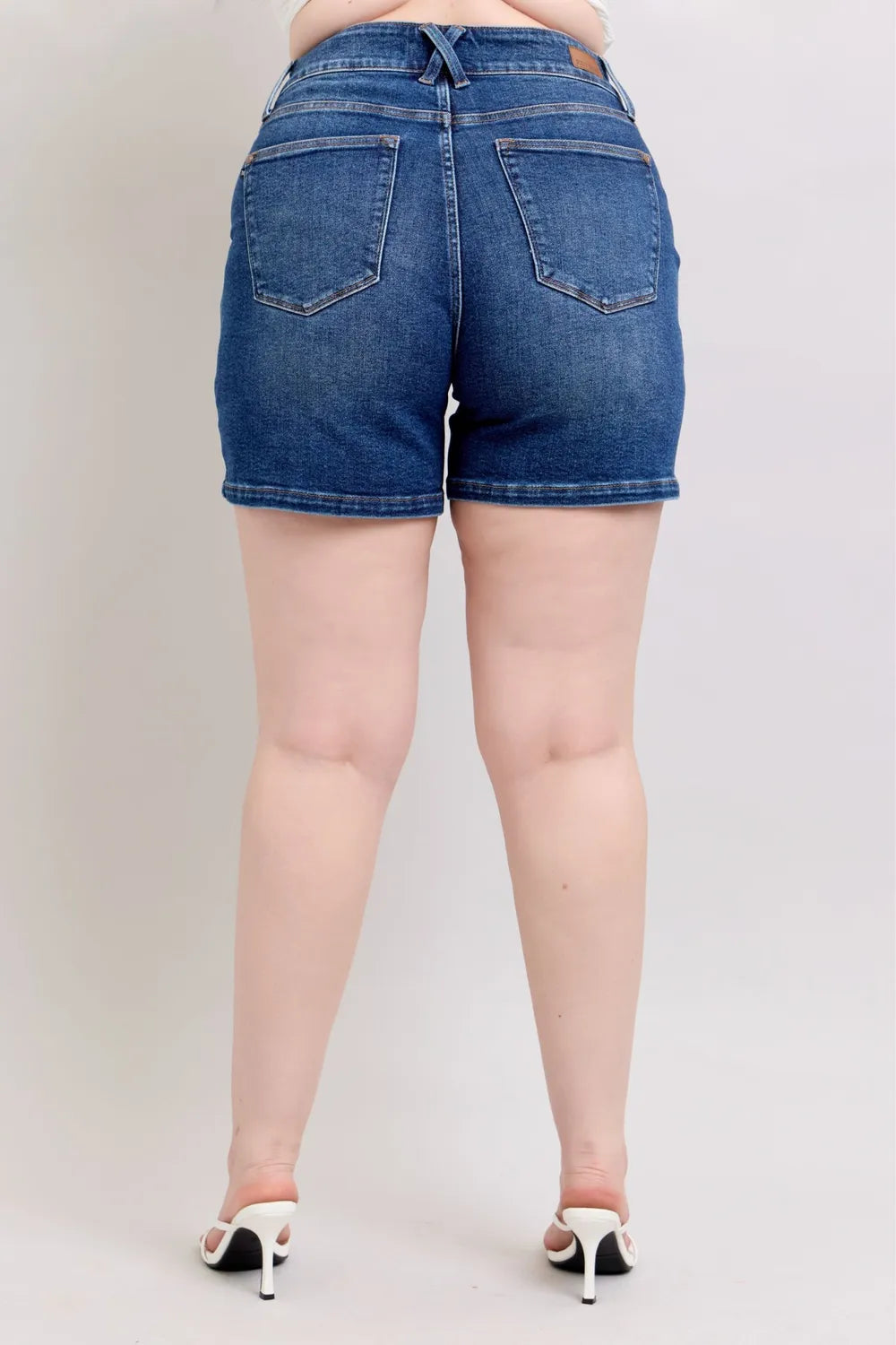 Back view dark denim shorts with two back pockets and belt-loop waistband
