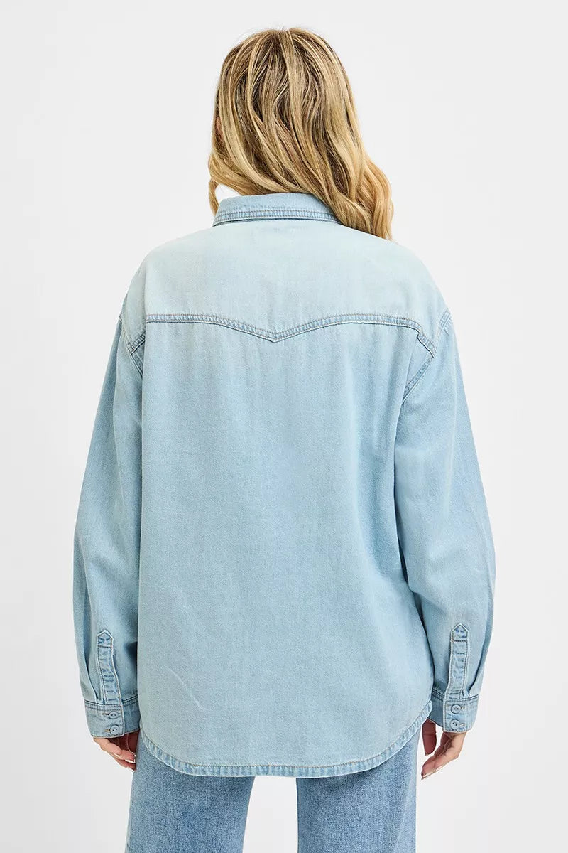 Back view: light blue denim western yoke relaxed fit shirt, full-length sleeves