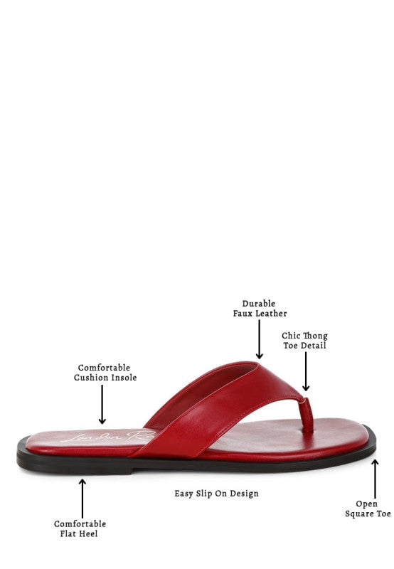 Red toe-post thong flats with open square toe, flat heel, and cushioned insole