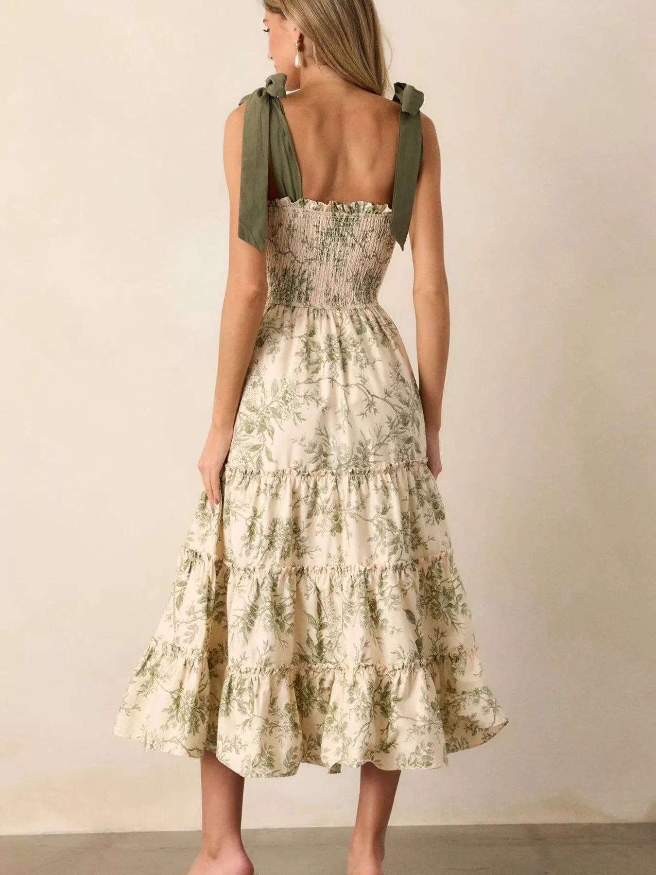 Sage green floral tiered midi dress, open back with tie shoulder straps