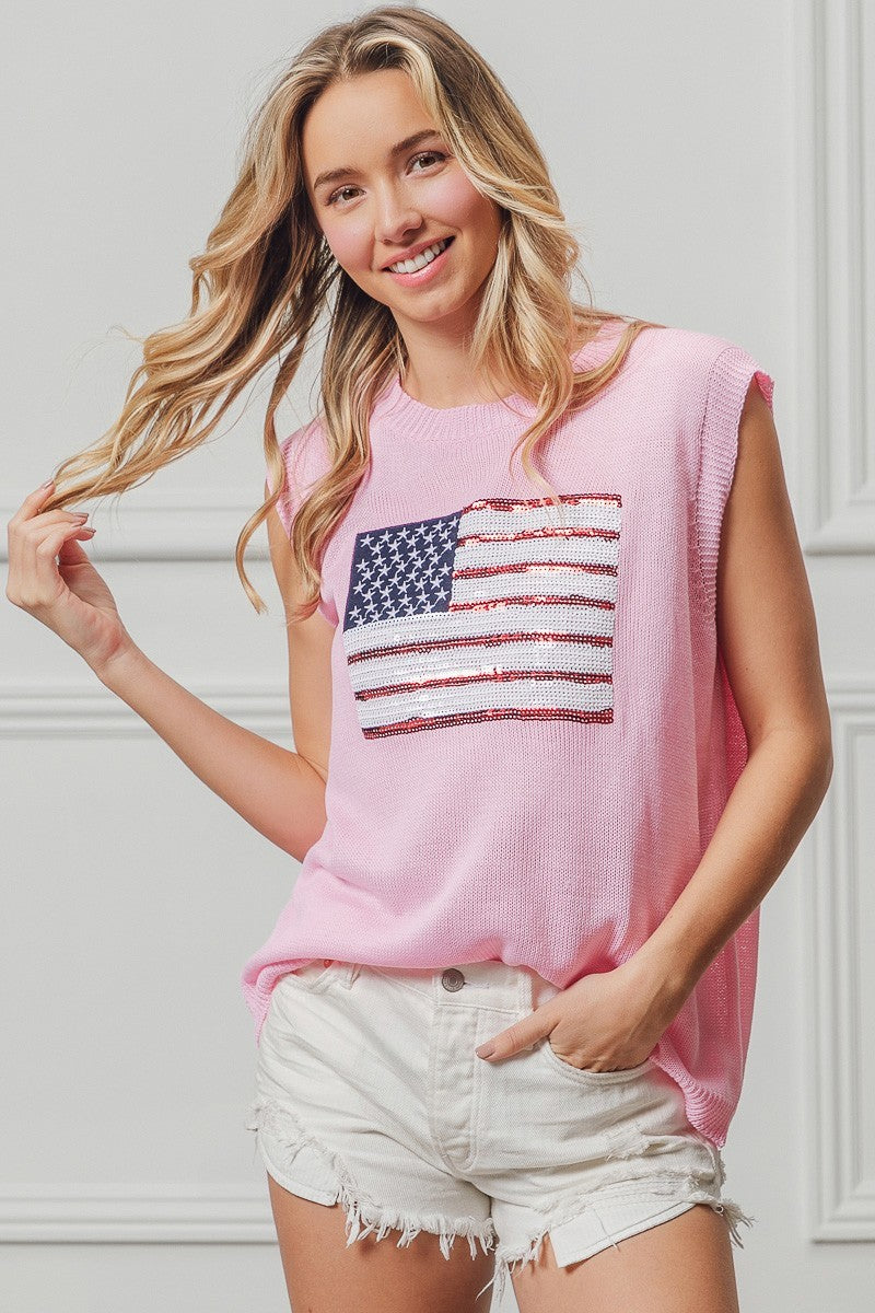 Pink sleeveless knit top with sequined American flag patch, crew neckline