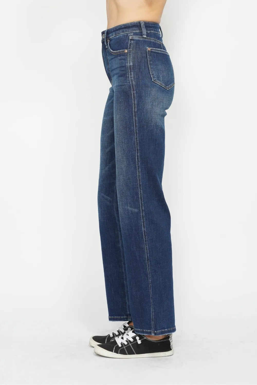 High-waist tummy control jeans, dark wash, side profile with wide straight hem.