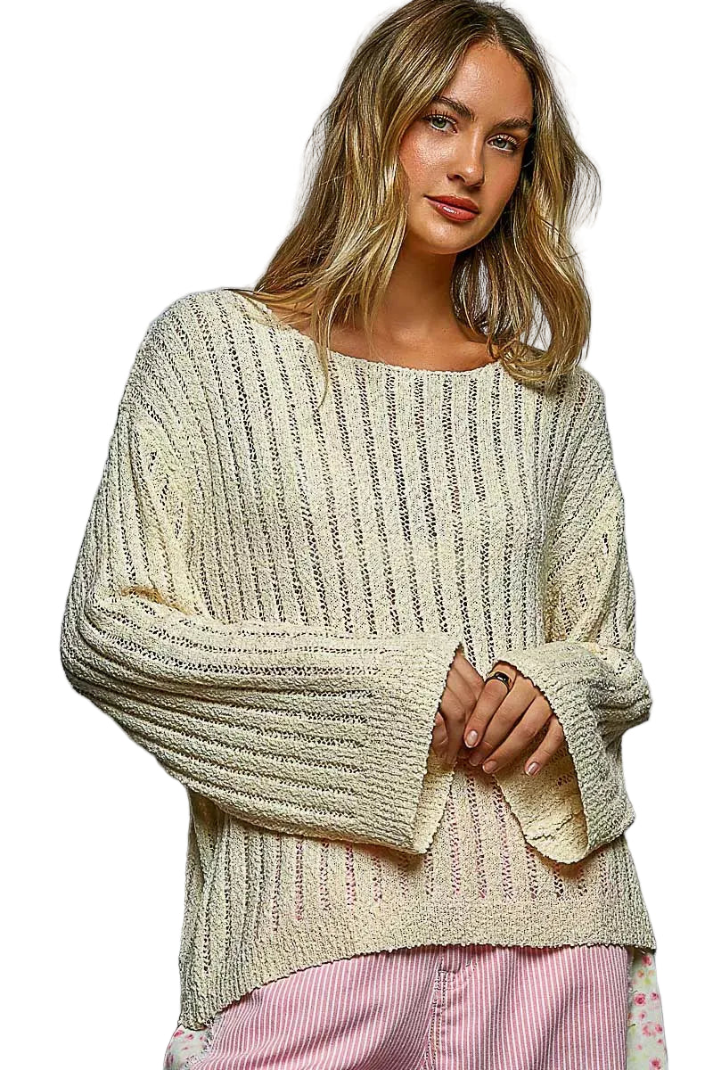 Tan open knit long sleeve sweater with round neckline and loose, textured stitch pattern