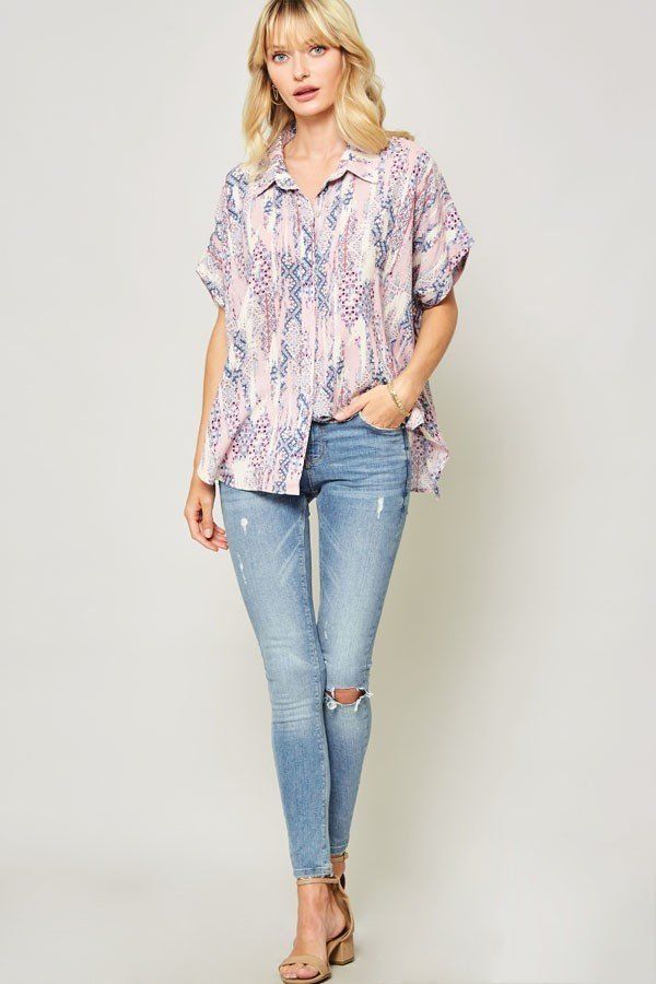 Ornate patterned woven blouse with collar and short sleeves, pastel print, hip length