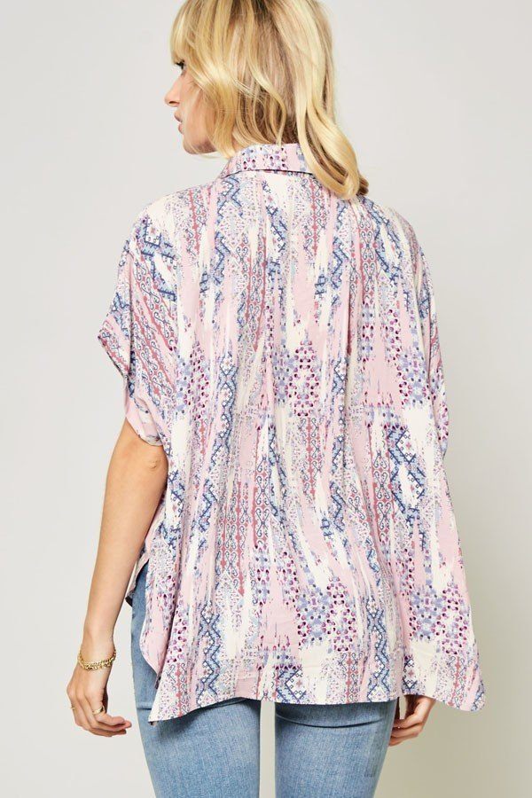 Ornate patterned woven top back view, collared button-up, short sleeves, pastel print