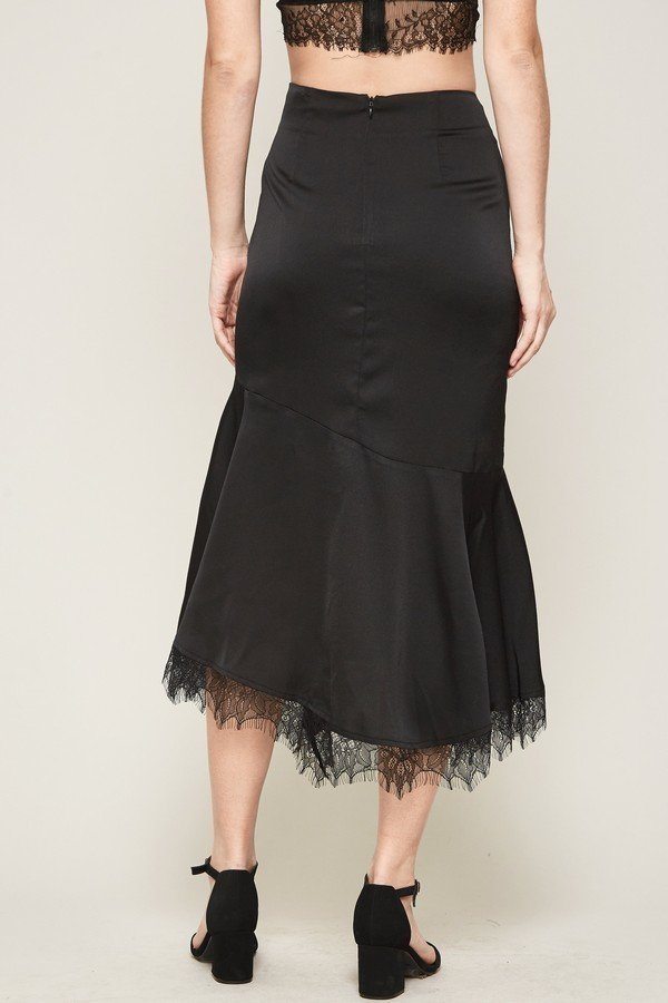 Solid woven midi skirt (black) back view with pleated look and lace hem