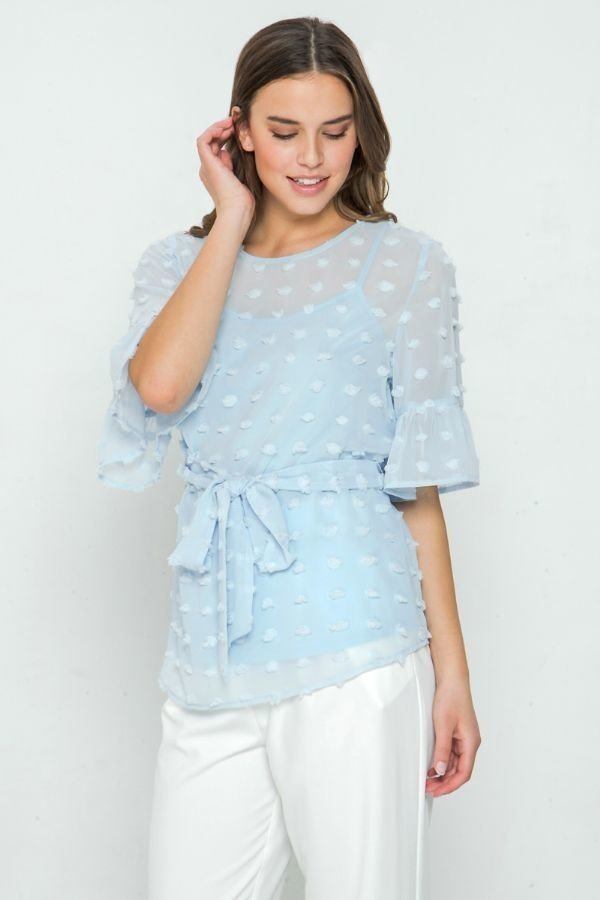 Light blue pom-pom top with drawstring waist tie and cascading ruffle detail