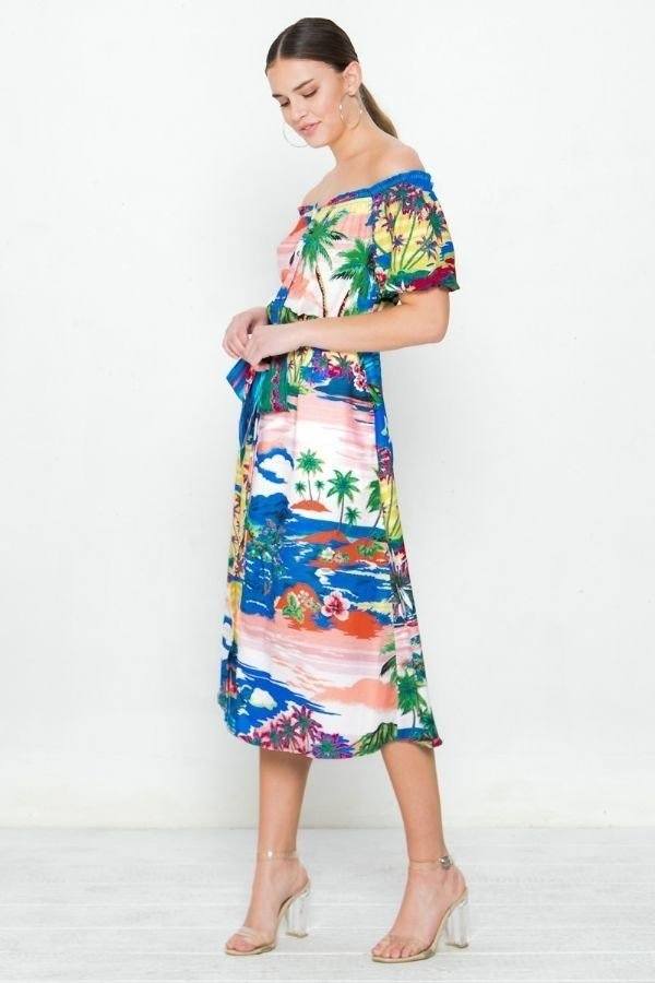 Side view: colorful tropical print off-shoulder woven dress with tie belt at waist.