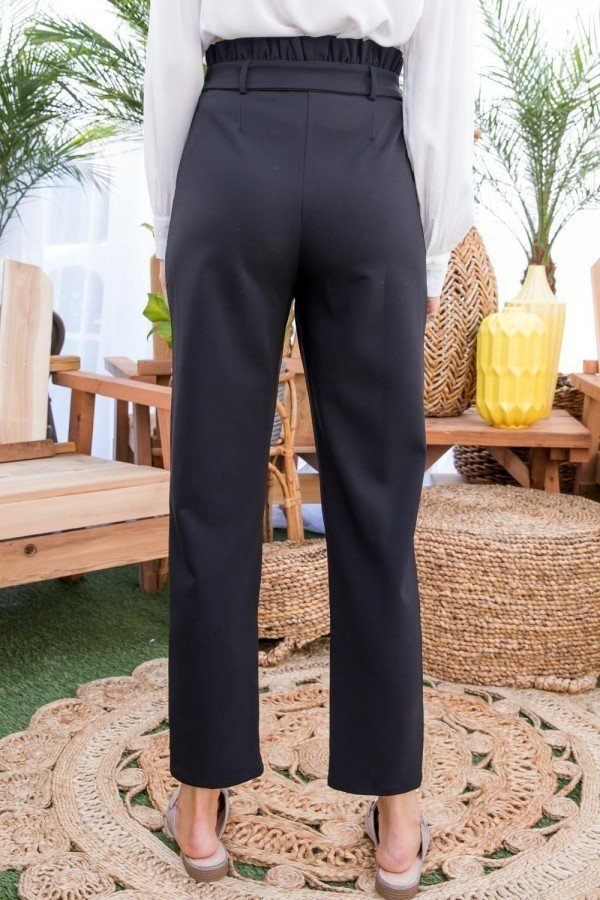 Black high-waist pants with elastic waistband and tapered ankle-length legs.