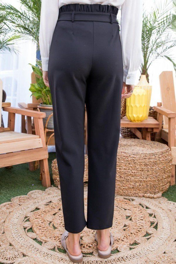 Black ankle-length pants with elasticated high waist and clean front.