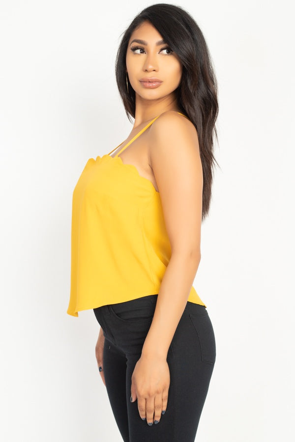 Light mustard cami top side view with scalloped neckline and thin shoulder straps