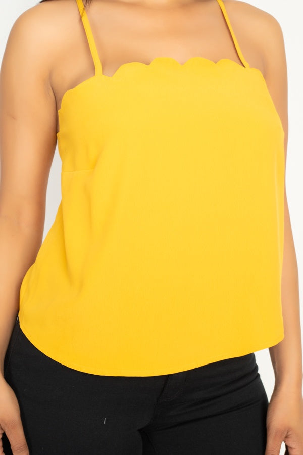 Close-up: light mustard scalloped neckline on cami top with thin straps