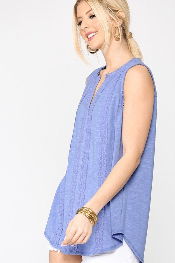 Denim blue sleeveless tunic with lace neckline and scalloped hem