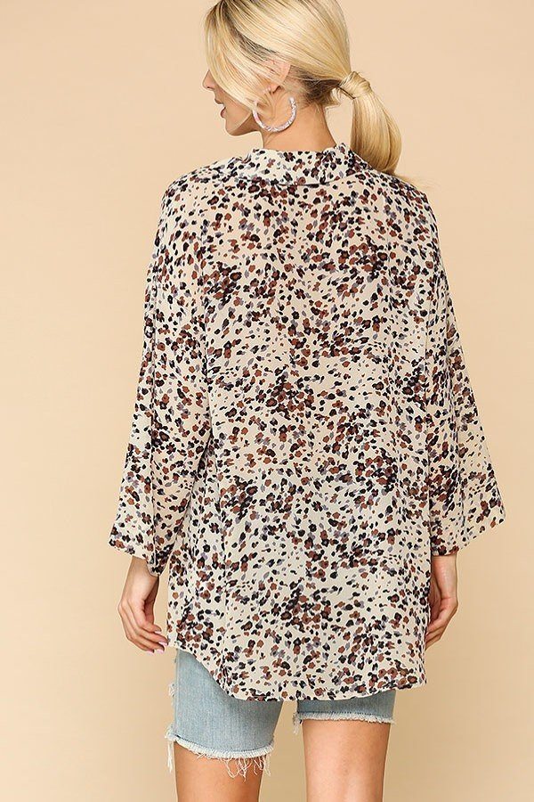 Cream animal print button-down shirt back view with 3/4 sleeves