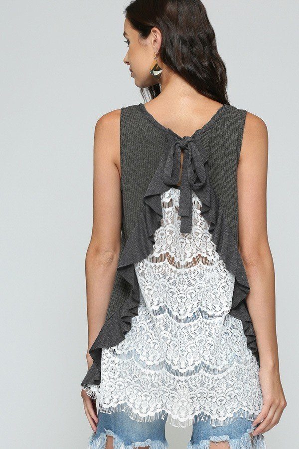 Back view: black tank with lace ruffle panel and tied bow