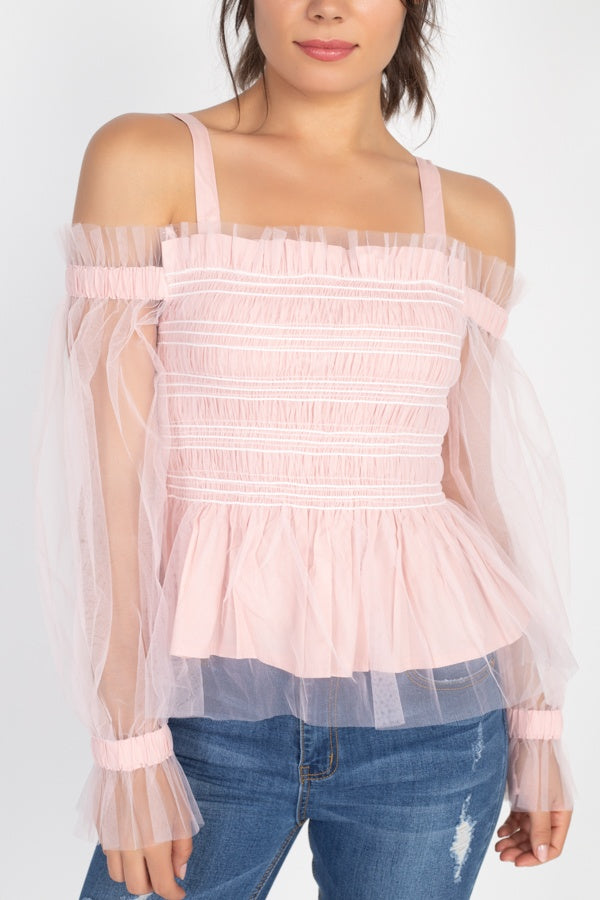 Close-up: Pink sheer mesh off-shoulder top with horizontal ruffle rows and peplum hem