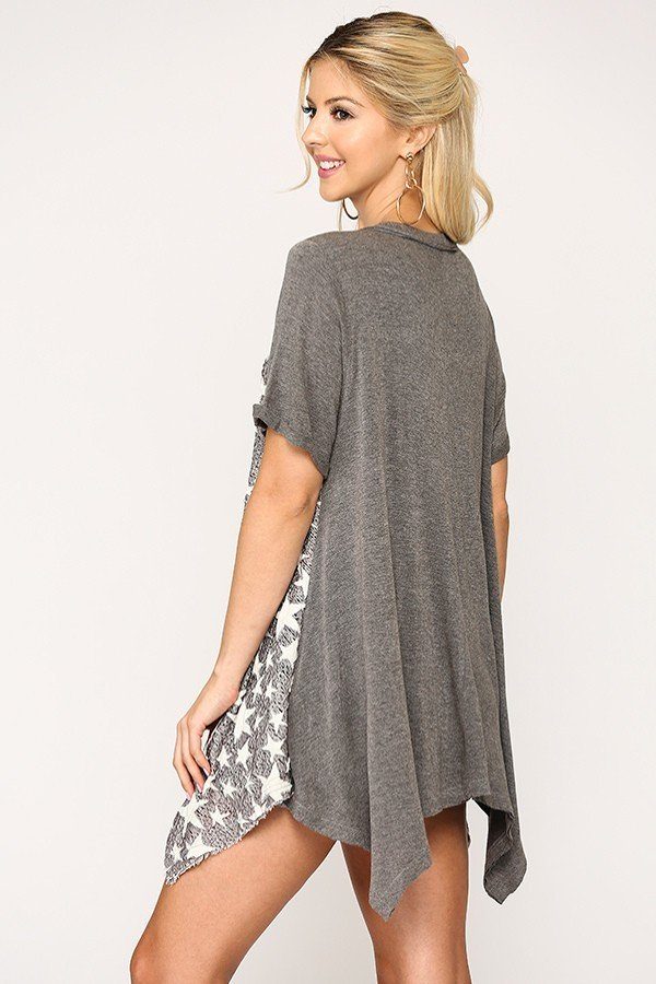 Back view of gunmetal gray star knit tunic with shark-bite hem and short sleeves