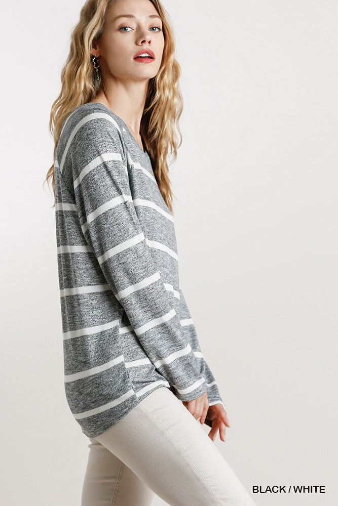 Striped long-sleeve top with round neck, black-and-white stripes, side view