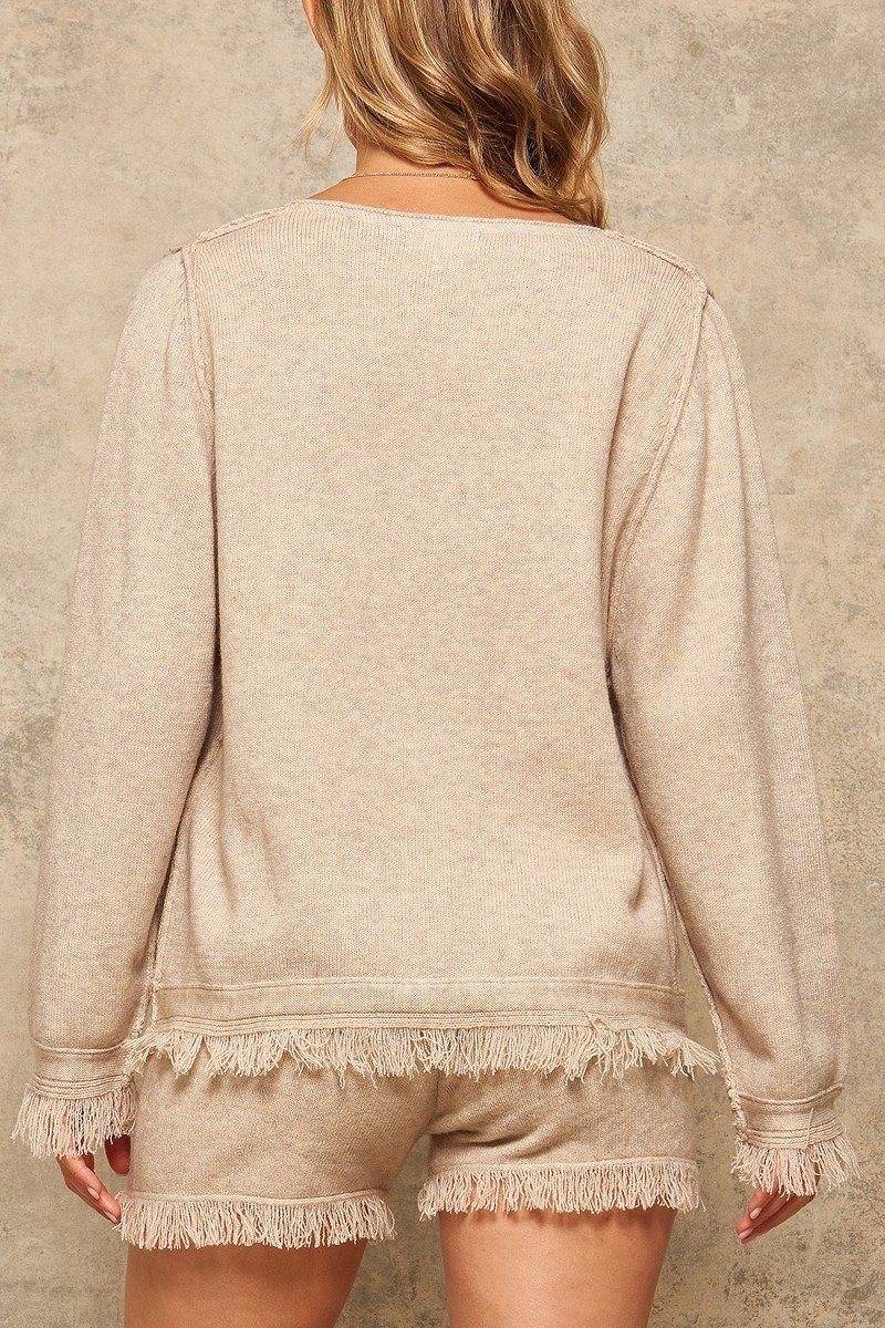 Back view beige solid knit sweater with off-shoulder cut and frayed trim at hem