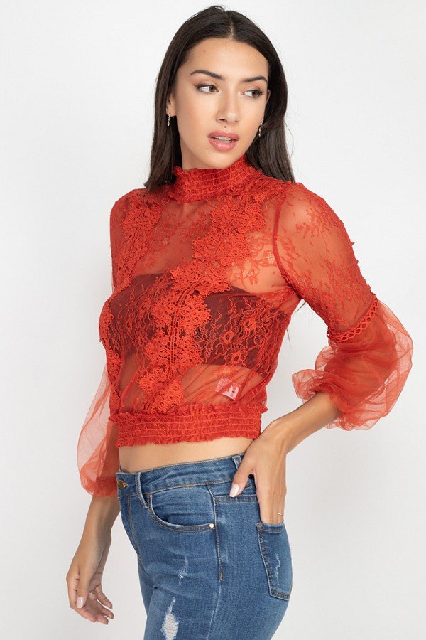 Red lace balloon-sleeve smocked top with high mock neck and scalloped lace hem